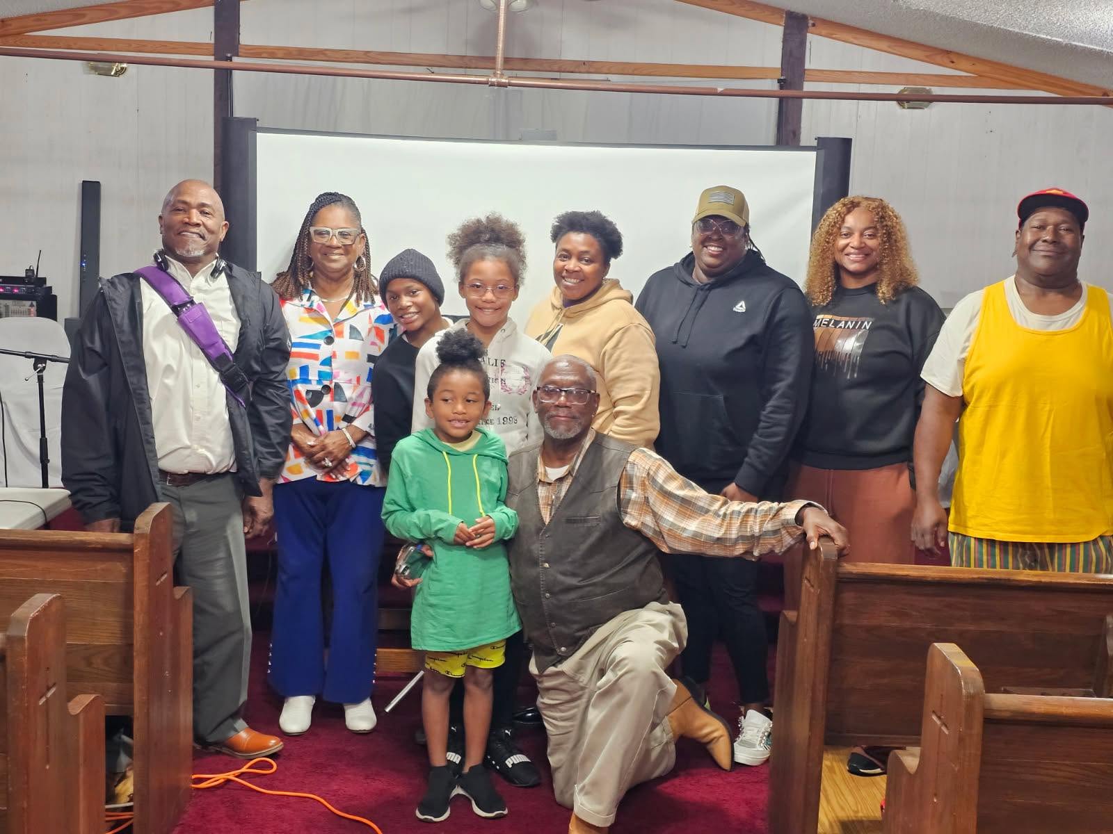 Community members and youth gathered together inside a church